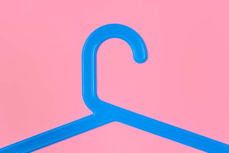 Flat lay composition with empty hangers on pink backgroundの写真素材