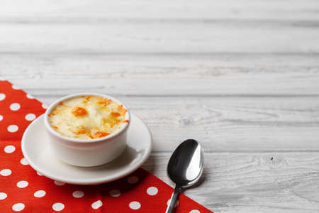 Mushroom juliene in bowl on wooden backgroundの写真素材