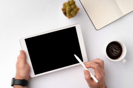 Digital tablet computer close up, man using tablet with hands