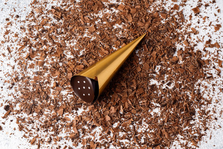 Grated chocolate and candy on gray backgroundの写真素材