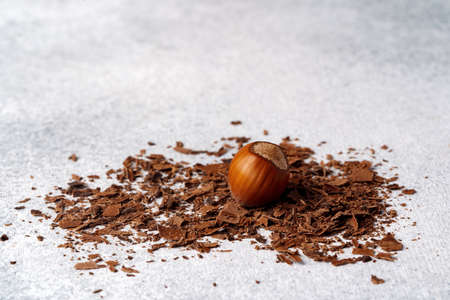 Grated dark chocolate shavings on gray backgroundの写真素材