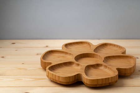 Wooden board for food on wooden backgroundの写真素材
