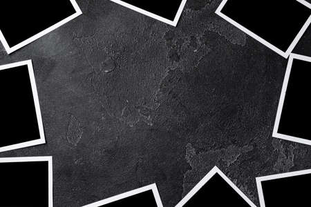Paper photo frames with blank space on gray textured backgroundの写真素材