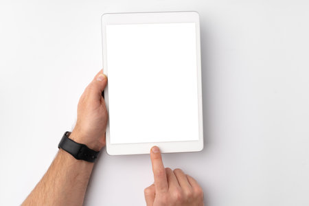 Digital tablet computer close up, man using tablet with hands
