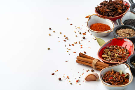 Bowls with various spices on white backgroundの写真素材