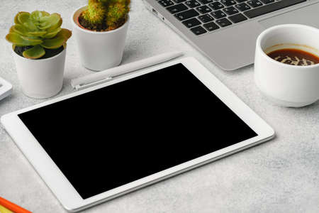 Digital tablet with empty screen on table with business accessoriesの写真素材