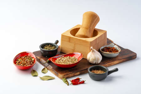 Composition with wooden board and ingredients for cooking on whiteの写真素材