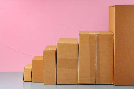 Set of cardboard boxes on pink backgroundの写真素材
