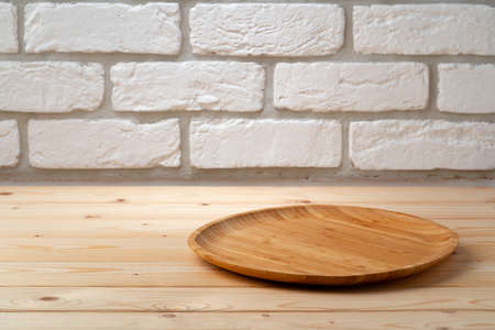 Wooden board for food on wooden backgroundの写真素材