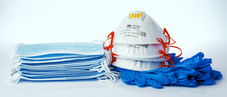 KRASNODAR, RUSSIA - JUNE 03, 2020 : 3M 8132 FFP3 respirator mask with blue medical masks and gloves on white backgroundのeditorial素材