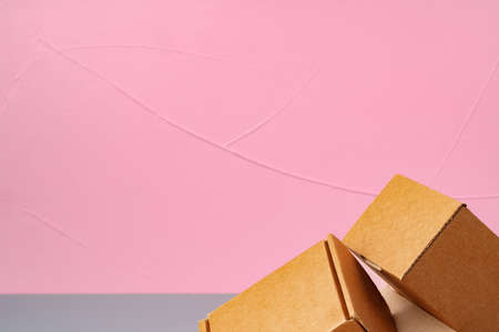 Set of cardboard boxes on pink backgroundの写真素材