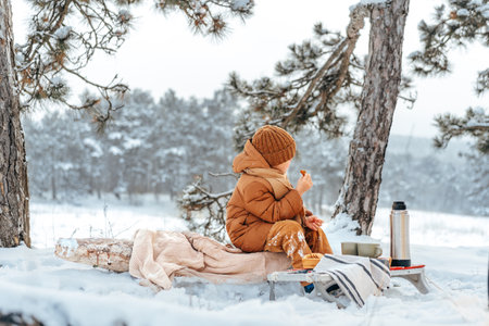 Little boy in a winter park or forestの写真素材