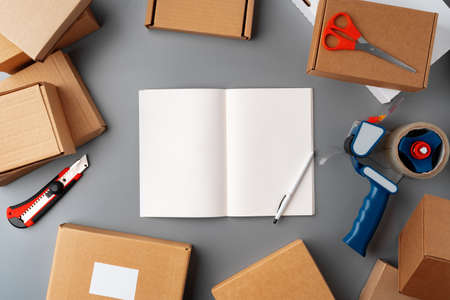 Above table top view of warehouse preparing post courier delivery packageの写真素材