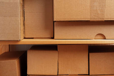 Cardboard boxes stacked in a pile for background