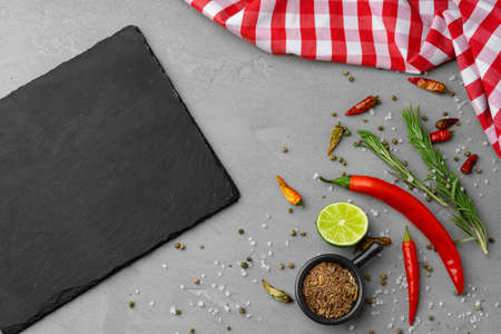 Various spices and herbs on gray backgroundの写真素材