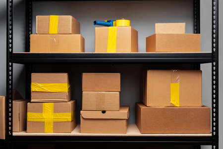Rack shelves with paper boxes in warehouse.の写真素材