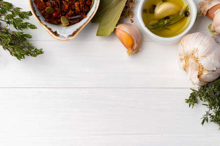 Olive oil and spices on kitchen table