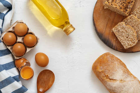 Preparation for baking. Eggs and flour on white background