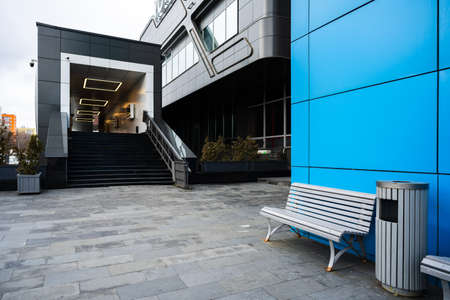 Bench and garbage can on the street