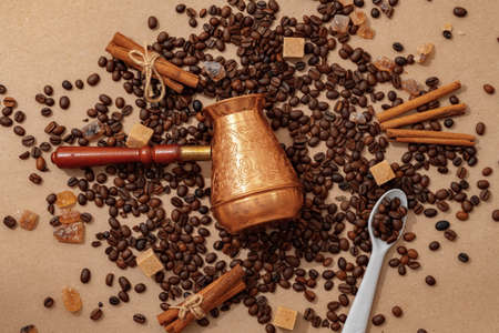 Coffee pot with coffee beans on paper backgroundの写真素材
