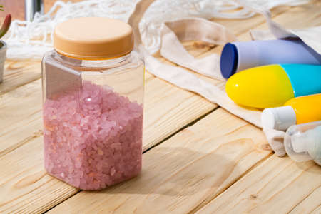 Pink quartz sage healing bath salt on wooden backgroundの写真素材