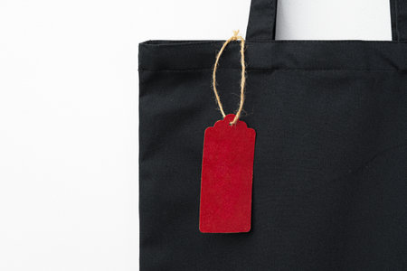 Eco bag for shopping with blank tag on white backgroundの写真素材