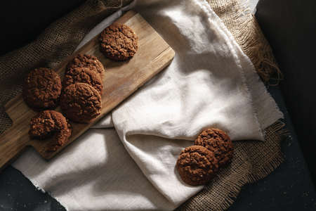 Glass of milk and cookies on table