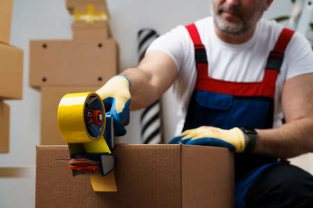 Man mover in uniform packing boxes