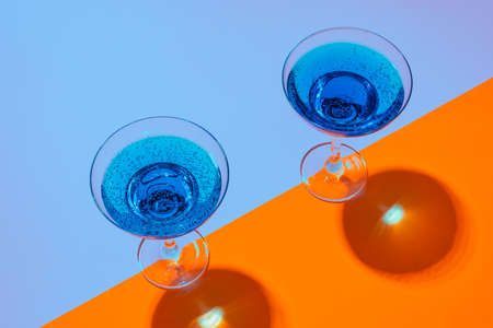Cold and refreshing cocktails on color backgroundの写真素材