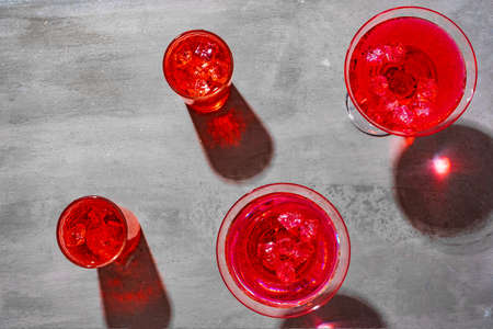Cold pink cocktail on concrete background close upの写真素材