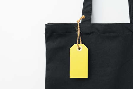 Eco bag for shopping with blank tag on white backgroundの写真素材