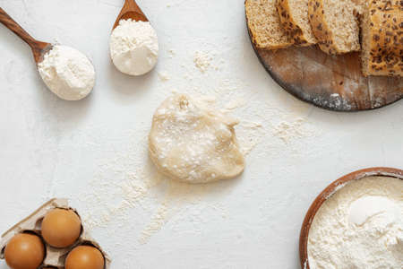 Preparation for baking. Eggs and flour on white background