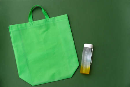 Reusable glass bottle and mesh bag flat layの写真素材