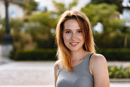 Portrait of a beautiful young woman outdoors
