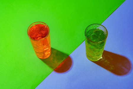 Cold and refreshing cocktails on color backgroundの写真素材
