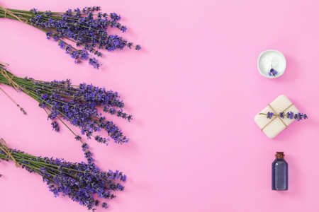 Lavenders spa products with dried lavender flowers on pink background.の写真素材