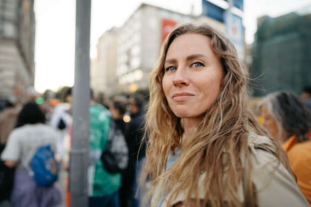 Portrait of a charming young woman posing for camera in the cityの写真素材