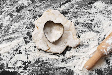 Preparation for cooking homemade cookies on flour backgroundの写真素材