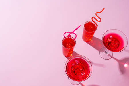 Pink summer cocktails on color background close upの写真素材