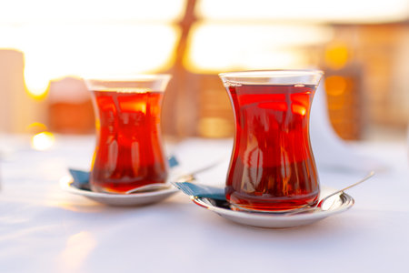 Two glasses with Turkish tea on white tableの写真素材