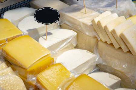 Assortment of appetizer cheese at food shop standの写真素材