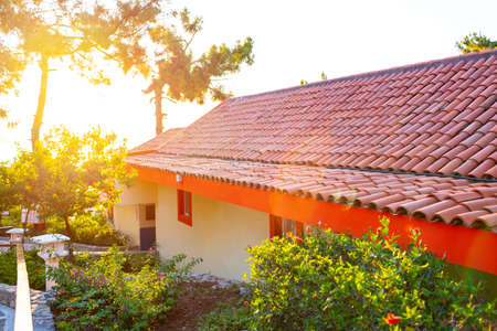 Little house with red terracotta roof tilesの写真素材