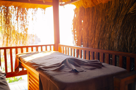 Massage table with sun canopy by the seaの写真素材