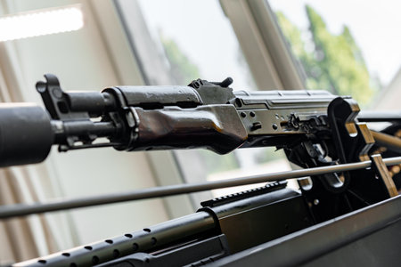 Automatic rifle on stand on the table of the weapons workshop.