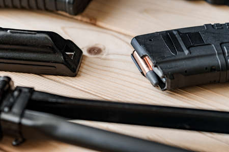 Shotgun parts on the wooden table background.