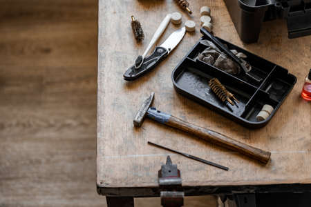Set of tools for cleaning and repairing weapons in workshopの写真素材