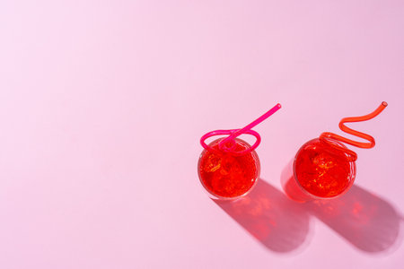 Summer drinks with straws on color backgroundの写真素材