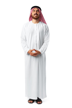 Smiling arab man while standing in a white studio