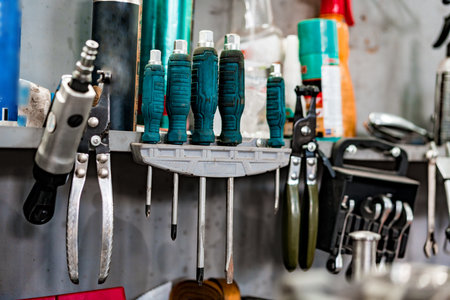 Large workbench with tools at station for vehicle technical servicing