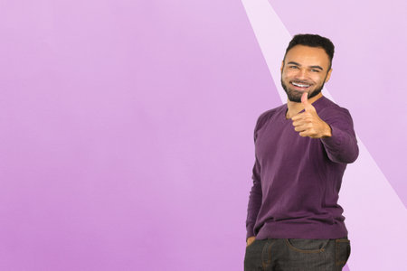 Portrait of stong and handsome african male student looking at camera smilingの写真素材